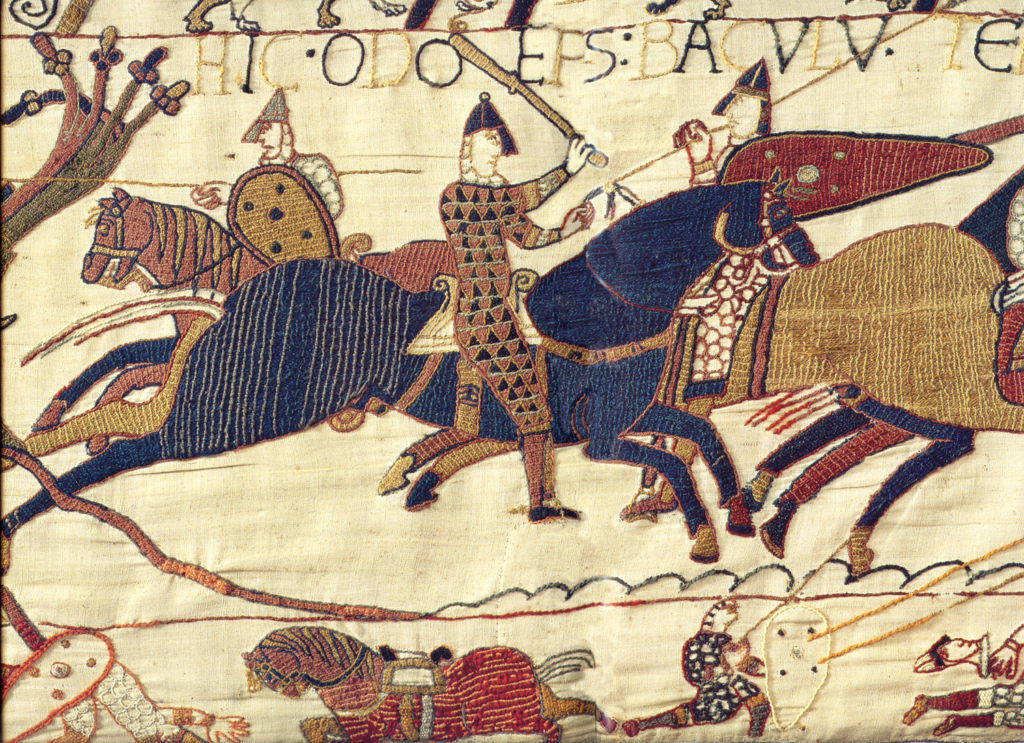 Detail from the Bayeux Tapestry showing Odo of Bayeux holding a club aloft